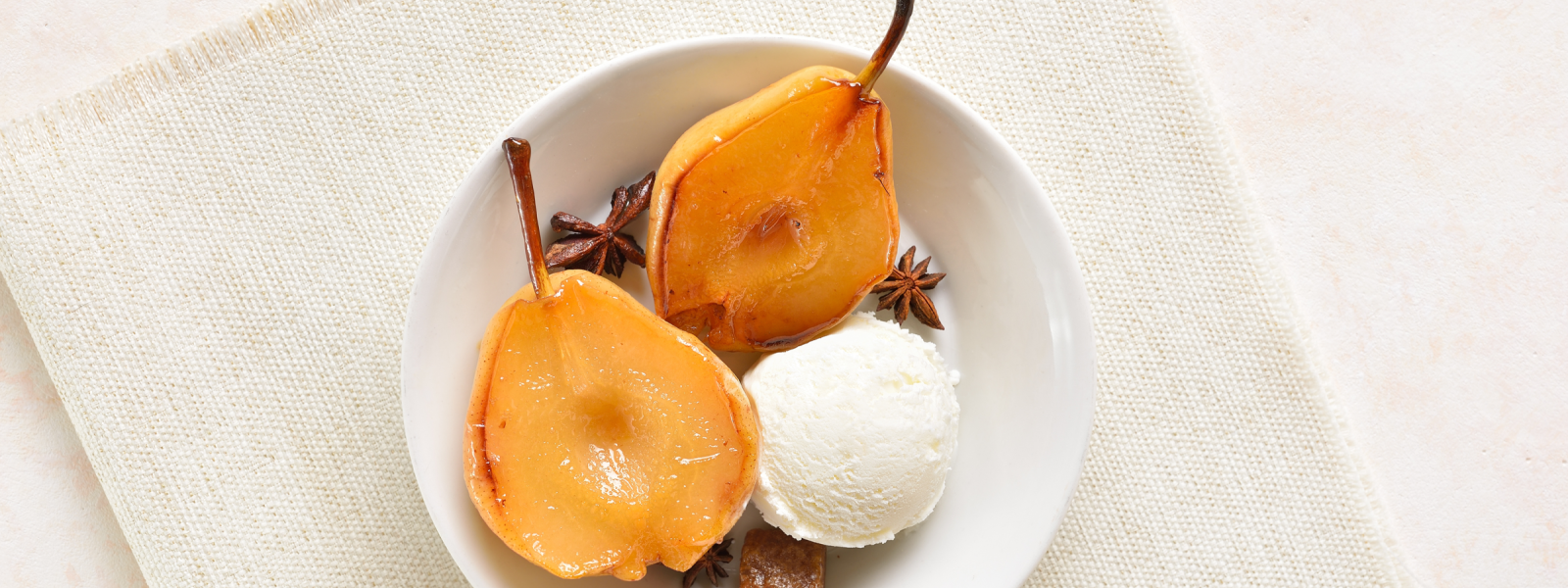 Image of poached pears with ice cream.