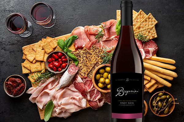 Image of Braganini Reserve Pinot Noir wine and cheese board. 